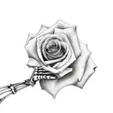 skeleton hand holding rose tattoo design idea