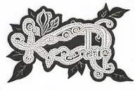 the word "Create" embroidered with thread and setting needle tattoo design idea