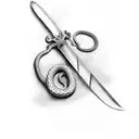 sword surrounded by snake tattoo design idea