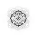 An intricate blackwork design of a Bohemian-inspired mandala with mountains and trees intertwined within tattoo design idea