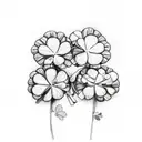 two touching irish shamrocks, one has sage and the other has rosemary tattoo design idea