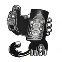 A tattoo of a computer game controller integrated into a futuristic bionic arm design, representing the client's passion for gaming and technology tattoo design idea