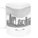 A coffee mug with the Los Angeles skyline and a cat sitting on top, with a ribbon that says 'Graduate Student' tattoo design idea