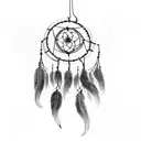 Dreamcatcher hanging from a tree branch with horses running below tattoo design idea