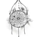 Dreamcatcher hanging from a tree branch with horses running below tattoo design idea