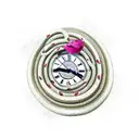 coiled snake above the clock with burgundy petals scattered everywhere tattoo design idea