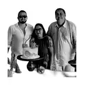 a group of people posing in front of a cake tattoo design idea