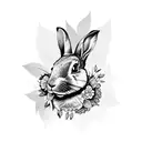 A black and grey tattoo of a rabbit surrounded by intricate floral patterns tattoo design idea