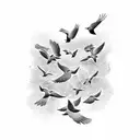 A black-grey tattoo showcasing a flock of birds in a geometric formation tattoo design idea