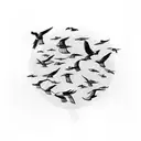 A black-grey tattoo showcasing a flock of birds in a geometric formation tattoo design idea