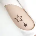 seashell and peter pan north star tattoo design idea