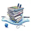 a stack of books a game controller crochet hooks and yarn tattoo design idea
