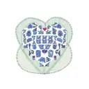 patchwork quilt shaped like a heart in printsin blue with the words I love you, Granny Rosa written in the stitching  tattoo design idea