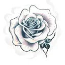 rose bush with barbed wire weaving through tattoo design idea