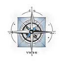 Compass with an arrow, four words around it tattoo design idea