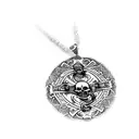 a pendant with a skull and crossbones on it tattoo design idea