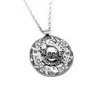 a pendant with a skull and crossbones on it tattoo design idea