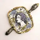 Square 1940s, hand mirror, lilacs intertwined, with a black and gold custom lipstick tube, and marbled black and brown c tattoo design idea