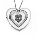 A heart-shaped locket with the initials of Vincent, Timmira, and Cadence inside tattoo design idea