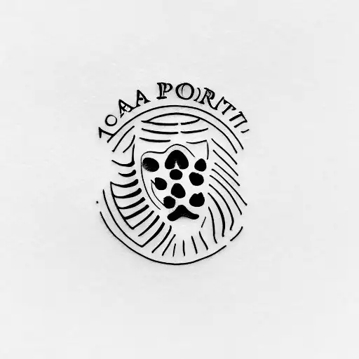 A minimalist tattoo of a passport with a cat paw print stamp tattoo design idea