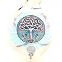 celtic tree of life with woman reading against the trunk tattoo design idea