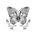 A blackwork tattoo showcasing a delicate butterfly resting on a blooming flower, representing your creative and free-spirited nature tattoo design idea