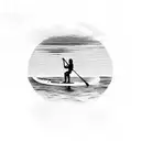 A majestic paddleboard gliding through calm waters with a breathtaking sunset in the background tattoo design idea