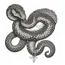 black snake on shoulder with tail going down towards triceps and front and head of the snake wrapping around collarbone tattoo design idea