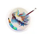 A paintbrush and a quill pen crossed together, with a phoenix silhouette in the background. tattoo design idea