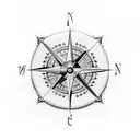 A Nordic-inspired compass with intricate gold detailing tattoo design idea