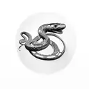 A camera lens morphing into a snake coiled around a paintbrush tattoo design idea