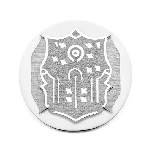 A security badge with a gun incorporated into the design, symbolizing loyalty and protection tattoo design idea