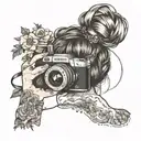 woman with hair up in a messy bun holding camera taking a picture. her shit in hanging down her left shoulder. floral tattoo design idea