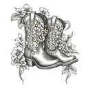 cowboy boots with wildflowers growing out of the top of the boots tattoo design idea