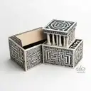 A box with a greek key design. Inside the box are four squares. Inside each square is one of the four Stoic virtues tattoo design idea