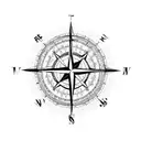 compass surrounded by flower blossoms with an arrow pointing north tattoo design idea