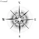 compass surrounded by flower blossoms with an arrow pointing north tattoo design idea