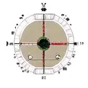 A chessboard patterned compass pointing towards a mountain peak tattoo design idea