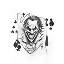 Joker playing a game of cards with a mischievous smile tattoo design idea