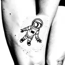 Small astronaut in space tattoo for thigh area tattoo design idea