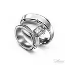 wedding ring and pacifier in cross of christ tattoo design idea