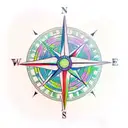 A realistic compass surrounded by colorful tropical flowers tattoo design idea