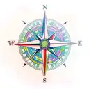 A realistic compass surrounded by colorful tropical flowers tattoo design idea