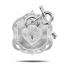 A heart-shaped lock and key with each son's name as the keyhole tattoo design idea