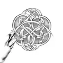 A Celtic knot design incorporating a blood glucose meter and insulin pump for Type 1 diabetes awareness tattoo design idea
