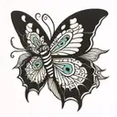 butterfly with snake eyes in the wings tattoo design idea