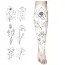 A sleeve tattoo featuring the birth flowers of February, March, April, May, September, and November in a dotwork style tattoo design idea