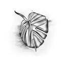 A minimalist tattoo of a monstera deliciosa leaf with a small airplane silhouette incorporated into its design tattoo design idea