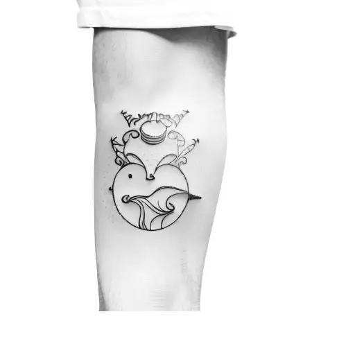 The tattoo in the photo depicts a stylized boy with spiky hair sitting on a crescent moon. Beneath the moon, there is a  tattoo design idea