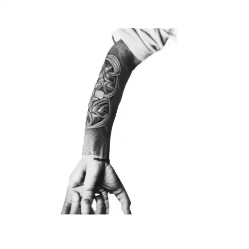 a tattoo on a person's arm inspired by Tupac tattoo design idea